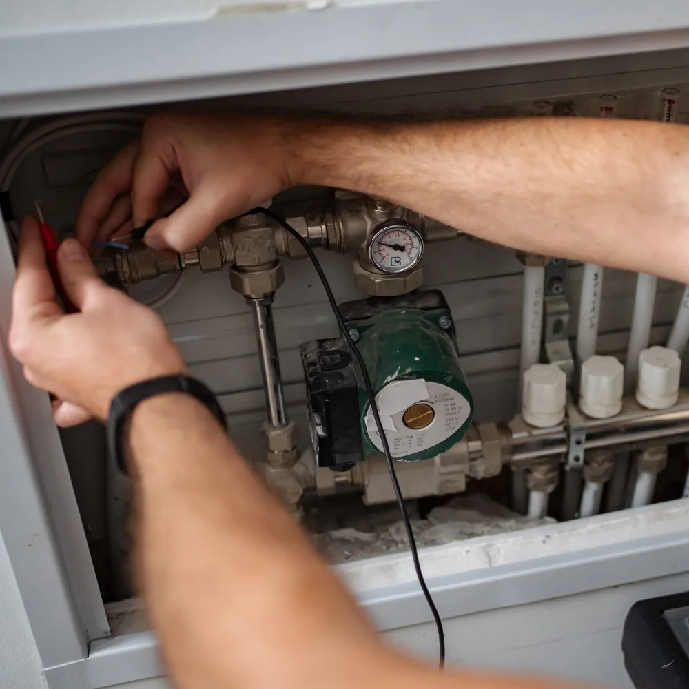 Furnace technician performing a diagnostic and safety check in a Bellevue, WA home